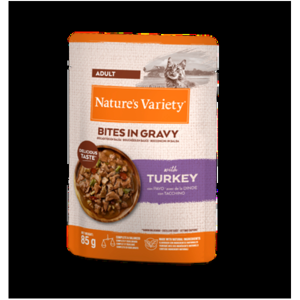 NATURE`S VARIETY Cat Bites in Gravy with Turkey 85G - pilnvērtīga barība pieaugušiem kaķiem, konservi, tvaicēti  tītara gaļās gabaliņi maigā mercē.